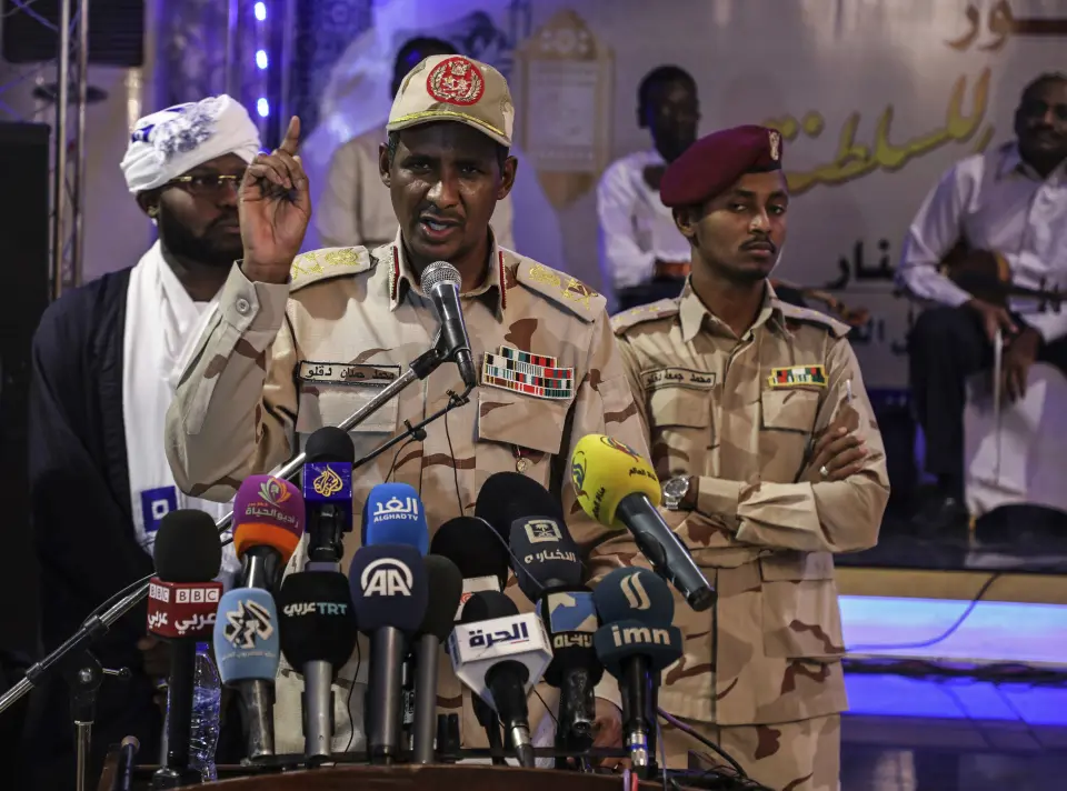 In this Saturday, May 18, 2019 photo, Gen. Mohammed Hamdan Dagalo, better known as Hemedti, the deputy head of the military council that assumed power in Sudan after the overthrow of President Omar al-Bashir, speaks to journalists in Khartoum, Sudan. At 44, he is the youngest member of the council. He says he refused orders from al-Bashir to fire on the protesters, and he praised them as recently as last weekend. (AP Photo)
